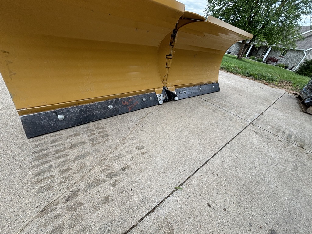 Manufactured wear plates installed on an attachment