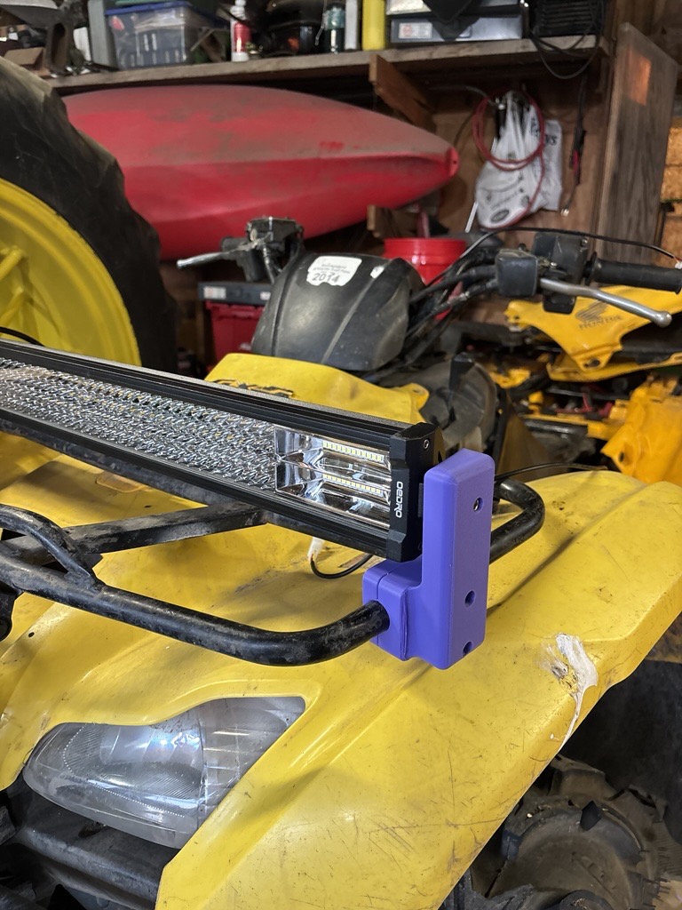 Custom 3D printed light bar mount on a four-wheeler