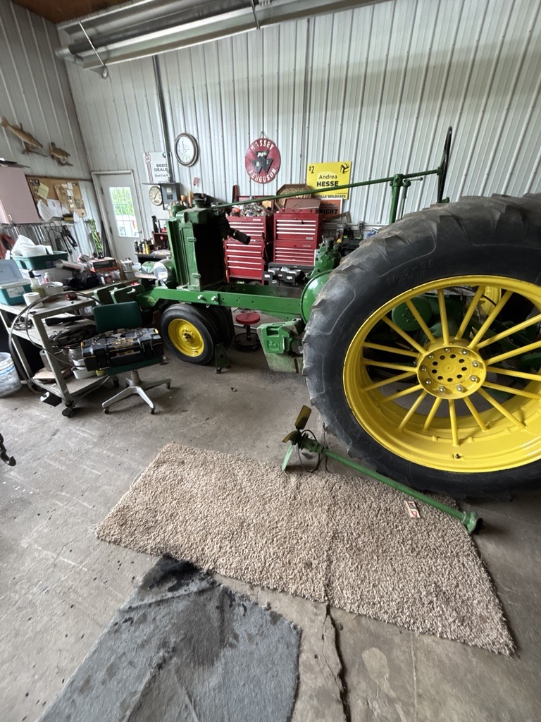The antique John Deere pulling tractor